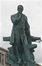 La statue de Jacques-Augustin Normand,oeuvre de Eugène Bénet, est inaugurée en 1911. Elle sera déposée en 1942 et replacée place de la Commune en 1956 sur un nouveau socle, le précédent ayant été endommagé par lors des bombardements.