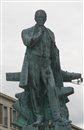 La statue de Jacques-Augustin Normand,oeuvre de Eug�ne B�net, est inaugur�e en 1911. Elle sera d�pos�e en 1942 et replac�e place de la Commune en 1956 sur un nouveau socle, le pr�c�dent ayant �t� endommag� par lors des bombardements.
